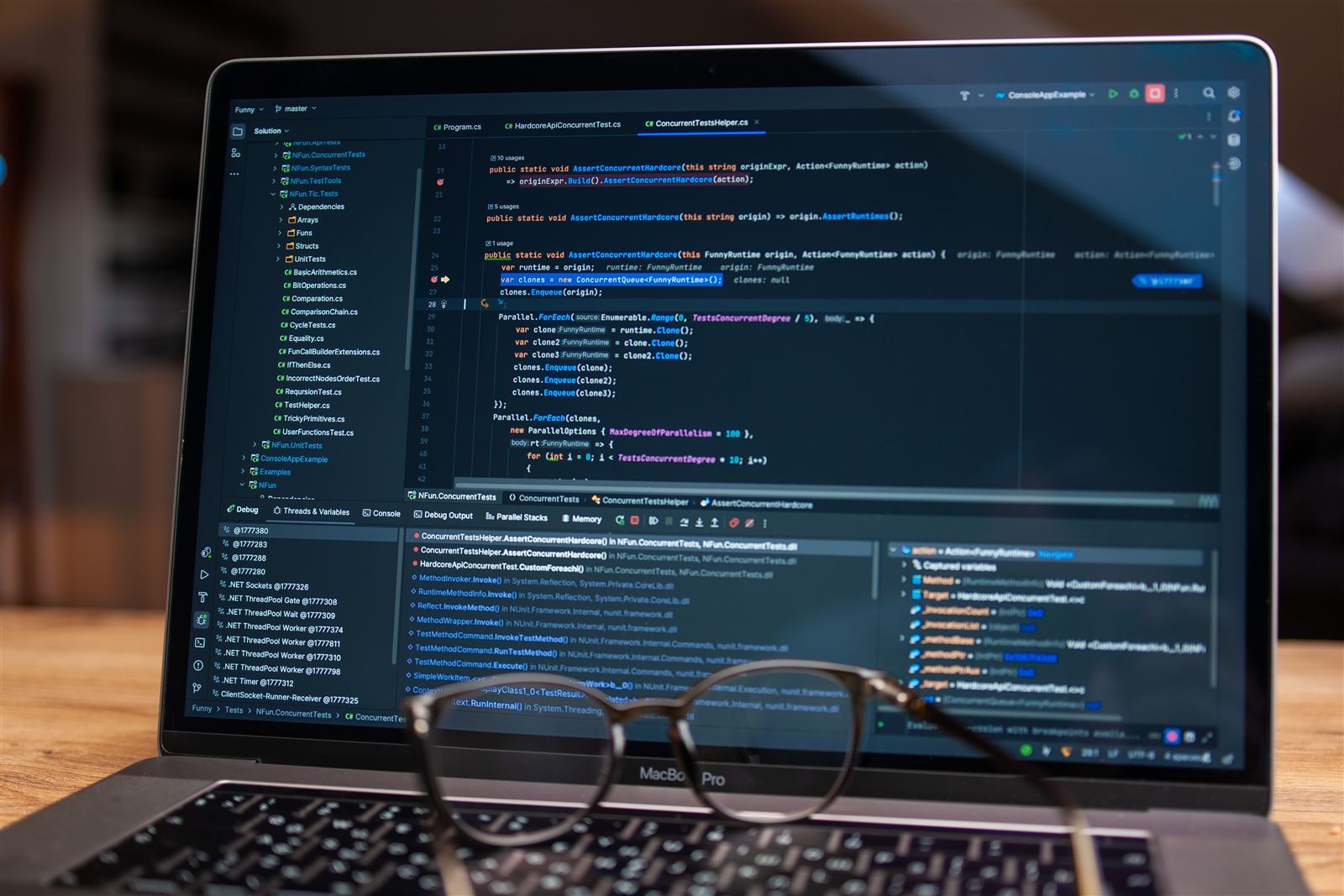 Custom web app code open in a development environment on a laptop
